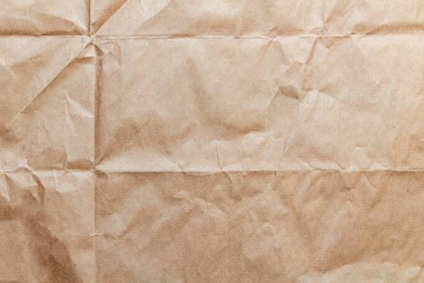 istock Crumpled craft paper, cardboard texture background 1270630851