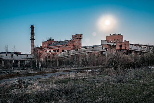 ruins of old abandoned factory under the moon