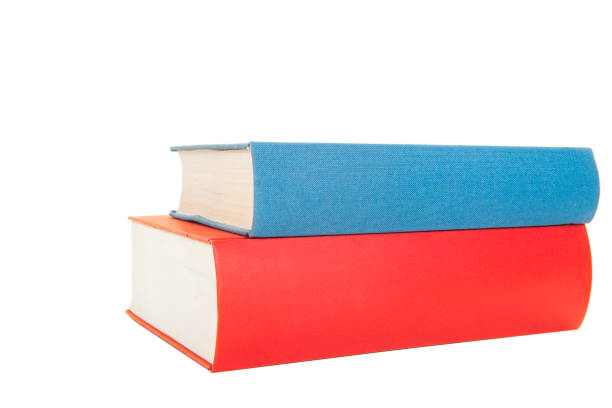istock Two books one red and one blue lying isolated on a white background 1270631555