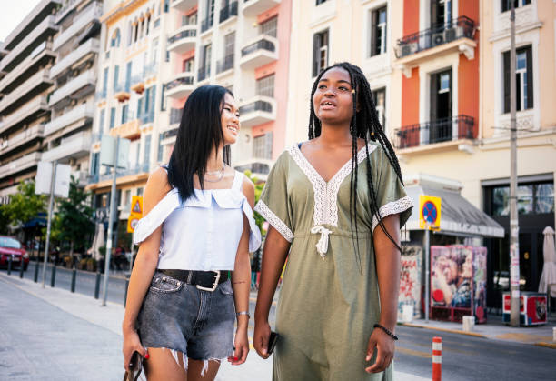 istock Friends walking through city, going for shopping 1270632479