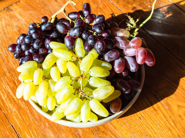 istock crimean white ladyfinger and red grapes on plate 1270632838
