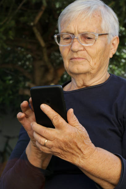 istock Elderly caucasian woman using cell phone. 1270634122