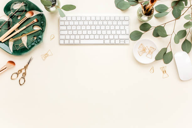 istock Flat lay home office desk. Female workspace with computer, plate sheet monstera, golden accessories, eucalyptus leaves, on beige background. Top view 1270634209