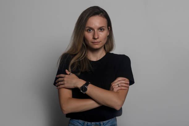 istock Offended vulnerable sad millennial girl looks at camera pose over grey studio background self hug closed pose folded crossed arms on chest, woman feels lonely cheated suffering 1270635868