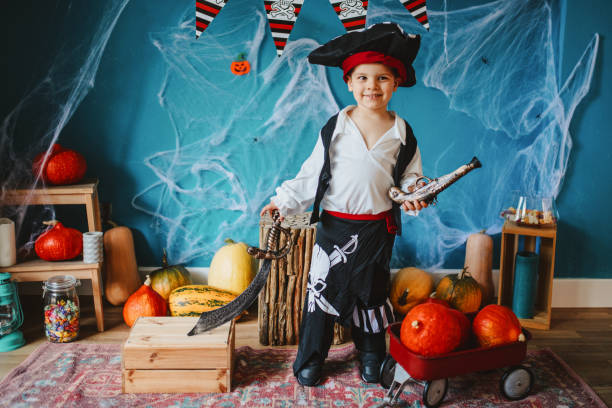 istock Cute little pirate getting ready for Halloween celebration at home 1270636192