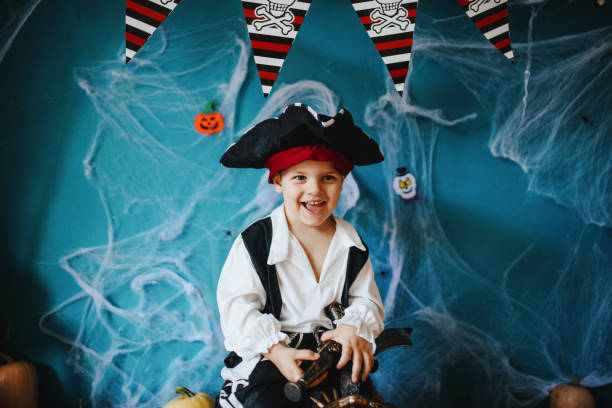 istock Cute little pirate getting ready for Halloween celebration at home 1270636252