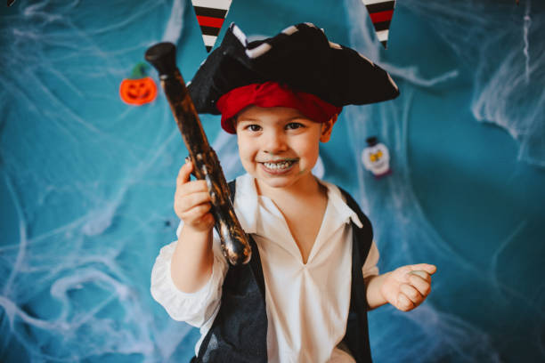 istock Cute little pirate getting ready for Halloween celebration at home 1270636253