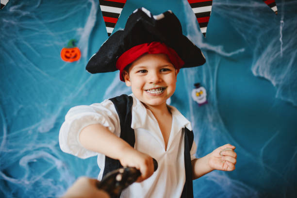 istock Cute little pirate getting ready for Halloween celebration at home 1270636778