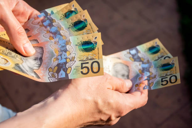 istock Hands holding australian dollars 50 banknotes. Finance and payment concept 1270636800