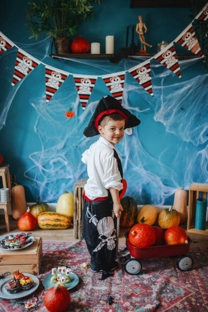 istock Cute little pirate getting ready for Halloween celebration at home 1270636842