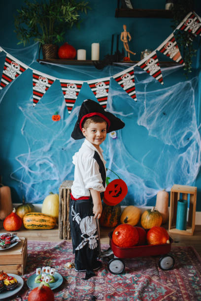 istock Cute little pirate getting ready for Halloween celebration at home 1270636869