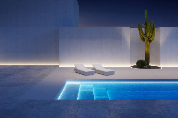 A luxury modern backyard with a swimming pool stock photo