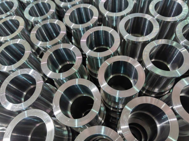 istock abstract industrial shiny steel production stack background with cnc machined pipes - selective focus and lens blur technique 1270637206