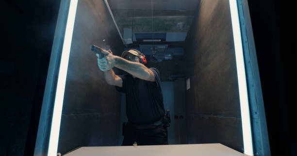 istock Mature shooter reloading and firing pistol 1270638118