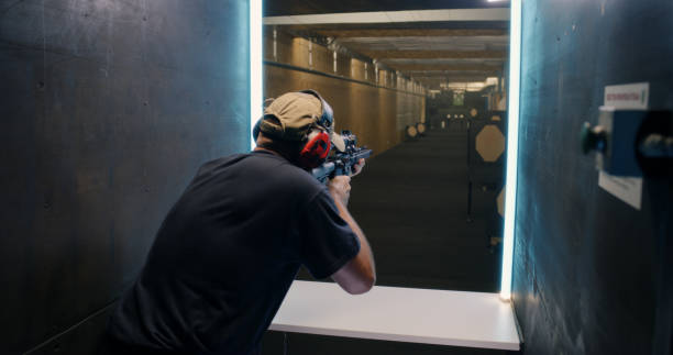istock Professional shooter firing at target 1270638163