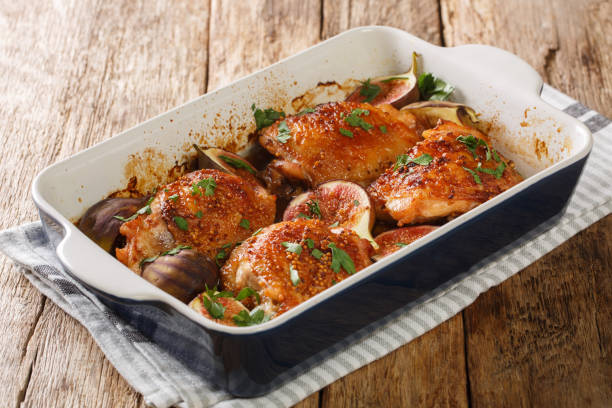 istock Rustic style chicken thighs baked with figs close-up in a baking dish. horizontal 1270641148