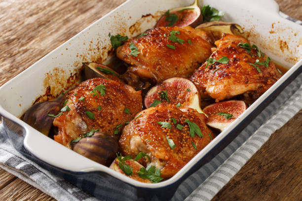 istock baked chicken thighs with figs and herbs close-up in a baking dish. horizontal 1270641258