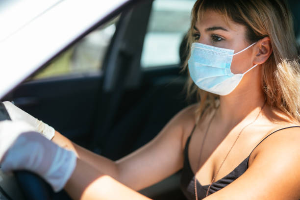 istock Serious young woman driving 1270641405