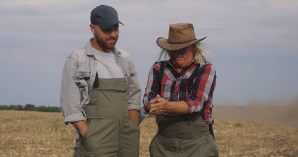 istock Positive farmers dispersing soil in air 1270641492