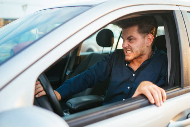 istock Young man gets furious over the traffic jam 1270642684