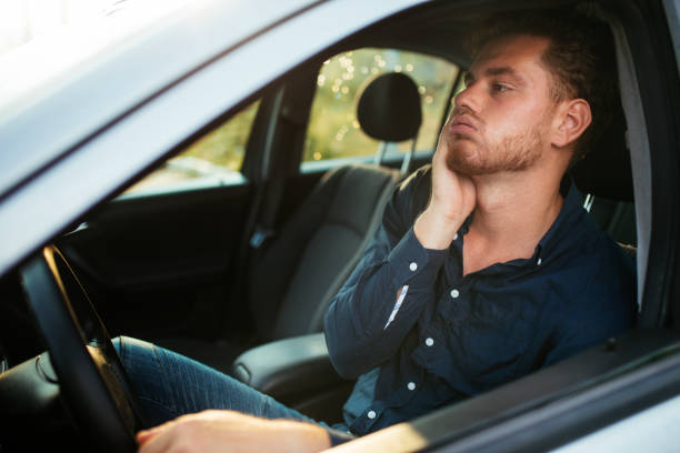 istock Handsome young man impatiently waits in the traffic jam 1270642923