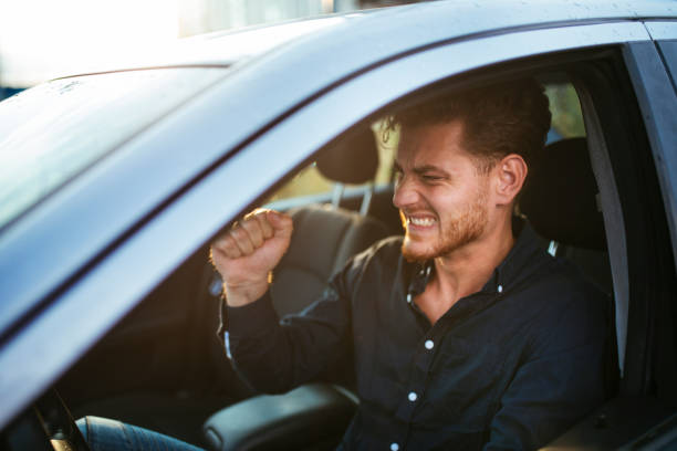 istock Young man gets irritated over the traffic jam 1270643443