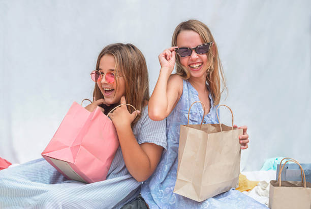 Children sort out shopping bags