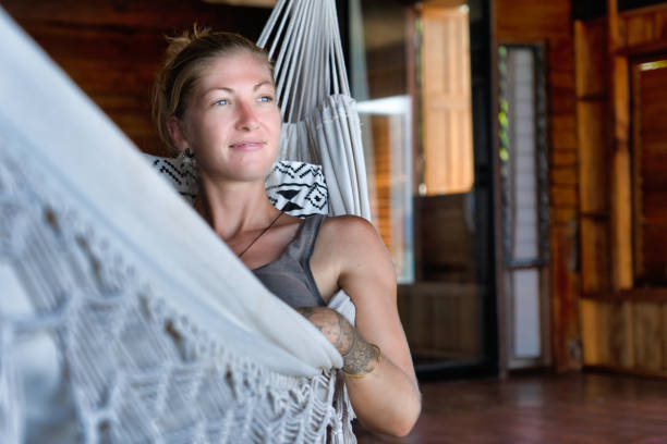 istock Millennial woman relaxing in indoor hammock practising mindfulness 1270644237