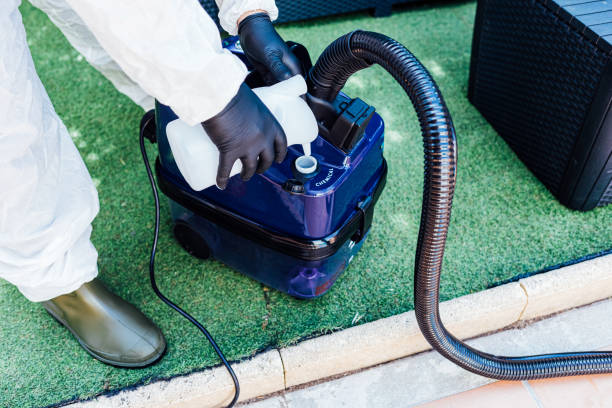 istock A man loading a disinfectant chemical into a machine to clean a house from COVID-19 1270647885
