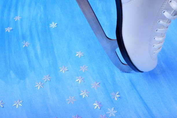 istock White figure skate against the blue background 1270649009