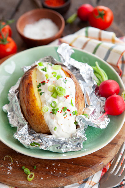 istock Baked potato with sour cream 1270650477