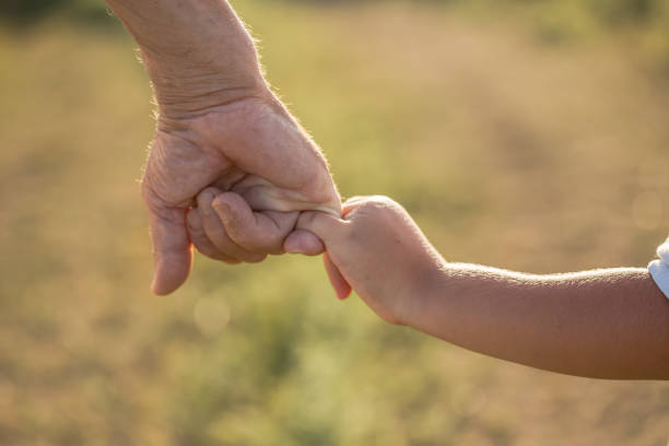 istock The grandfather holds grandson in a lap park 1270651616