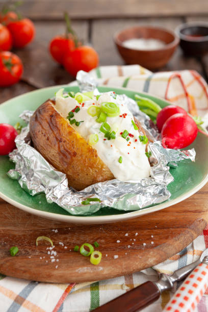 istock Baked potato with sour cream 1270651681