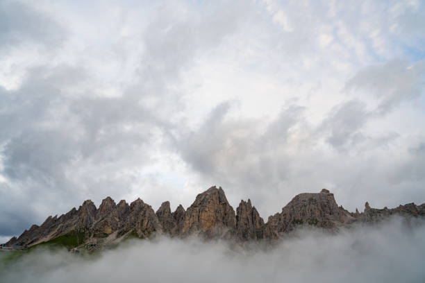 Dolomites mountain during a terrible weather foggy sunset