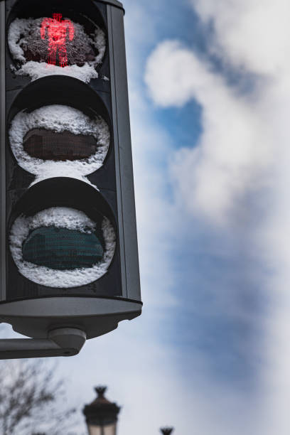 istock Danger, jeopardy, risk and hazard concept: a pedestrian traffic light covered with snow is red suggesting to halt, Dublin 1270654754