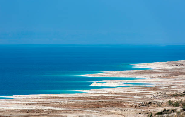 istock Dead Sea;  Blue lake waters and interestingly shaped beach 1270656758