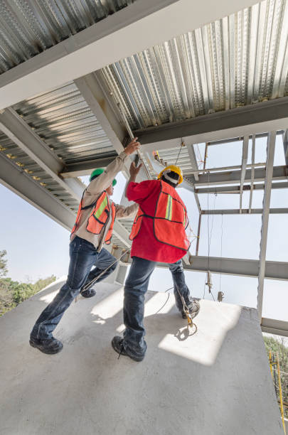 istock Workers raising a cemented landing stair platform in construction site 1270662846