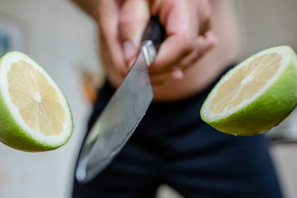istock Lime is cut with a sharp knife in the air 1270663948