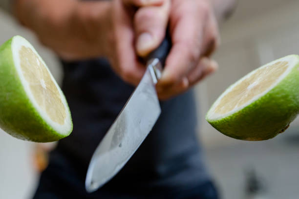 istock Lime is cut with a sharp knife in the air 1270664568