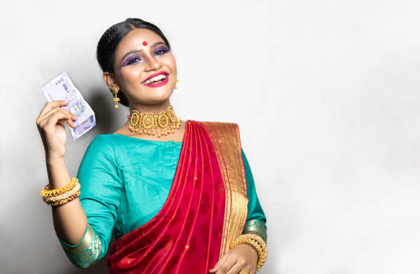 istock Happy woman holding Indian rupee notes 1270665408