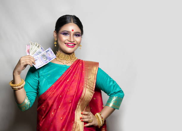istock Happy woman holding Indian rupee notes 1270666579
