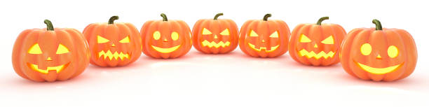istock Many Halloween Pumpkins in a row on white background. 3d rendering 1270666789