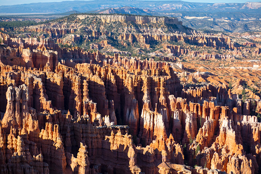 Bryce Canyon National Park is distinctive due to geological structures called hoodoos, formed by frost weathering and stream erosion of the river and lake bed sedimentary rocks