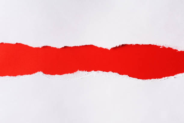 istock White paper with torn edges isolated with a bright red color paper background inside. Good paper texture. 1270671347