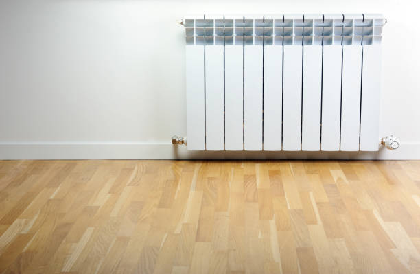 istock White radiator in an apartment. Radiator. 1270671409