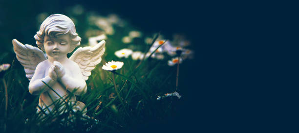 istock Guardian angel kneeling and praying 1270672541
