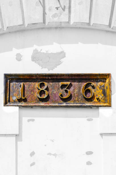 Rusty metal plate with 1836 date
