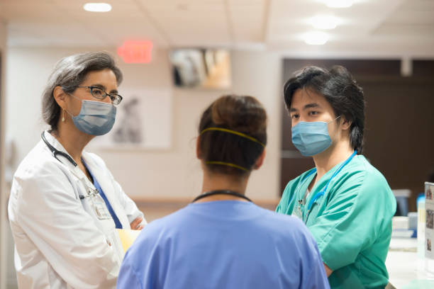 istock doctors at hospital wearing mask covid 19 1270674069