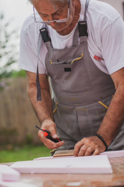 istock Senior carpenter working in his back yard during isolation 1270675412