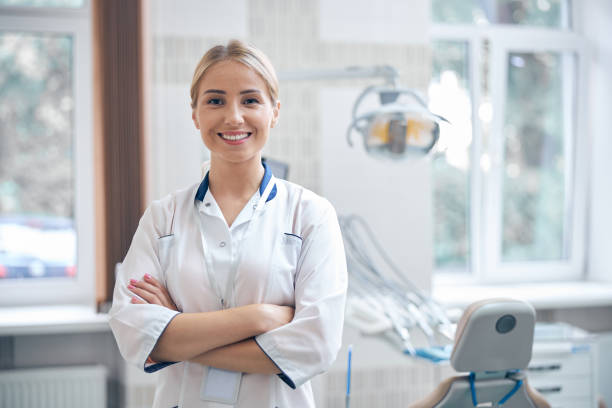 istock Cheerful beautiful dentist waiting for patients in clinic 1270675562